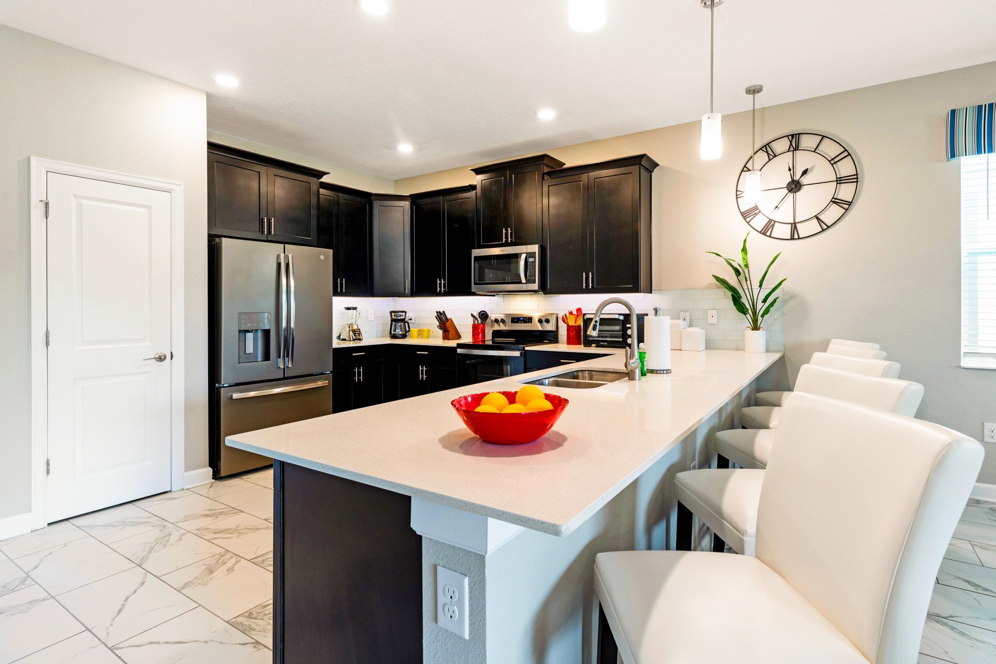 Kitchen with open floor plan with seating for 5 at breakfast bar