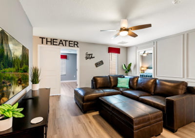 Loft Space - 65 inch Smart TV - Leather couch next to theater