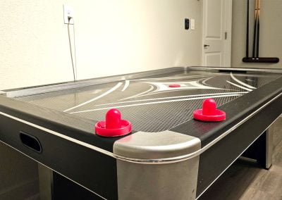 8 foot air hockey table in a game room with A/C