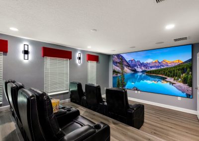 The movie theater seats 10 and features a 4K Laser Projector, 150 inch screen and Dolby Atmos Surround sound