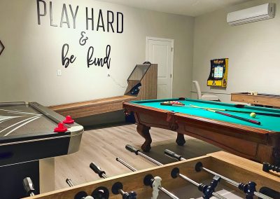 Climate controlled game room with pool table, air hockey, skeeball, shuffleboard and foosball
