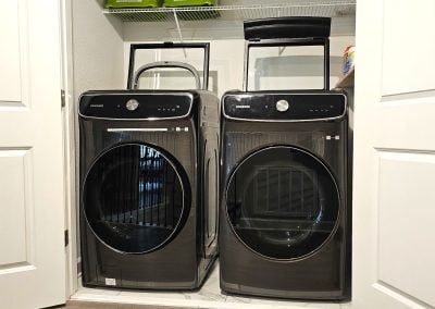 Extra-large front loader washer and dryer both with small top loader also