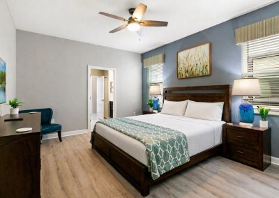 Champions Gate Spectacular vacation rental by owner Primary King bedroom with en suite and a door to lanai